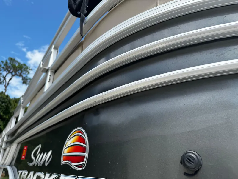 Slide: The Image of 2023 Sun Tracker Party Barge 22 DLX pontoon boat, close-up view of exterior design. - 25