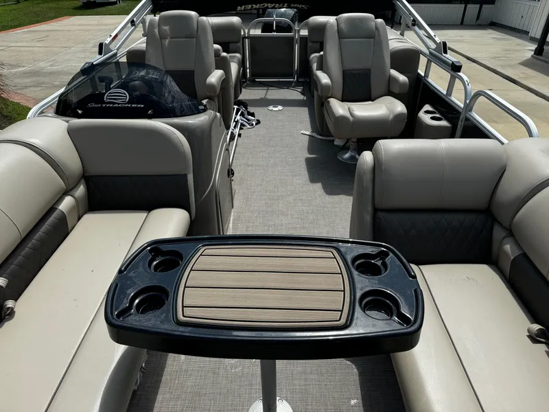 Slide: The Image of 2023 Sun Tracker Party Barge 22 DLX interior with seating and table. - 36