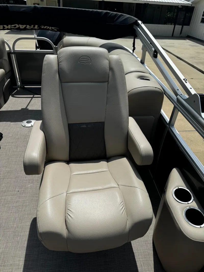 Slide: The Image of 2023 Sun Tracker Party Barge 22 DLX captain's chair with armrests and cup holders. - 37