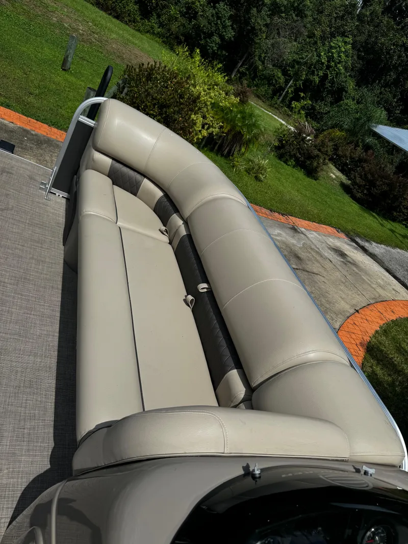 Slide: The Image of 2023 Sun Tracker Party Barge 22 DLX with beige seating on a sunny day. - 4