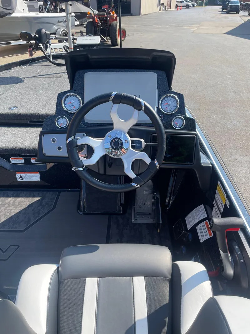 Slide: The Image of 2025 Nitro Z21 XL Pro boat dashboard with steering wheel and gauges. - 10