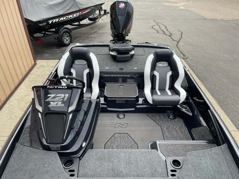 Slide: The Image of 2025 Nitro Z21 XL Pro boat interior with dual seats and steering console. - 5