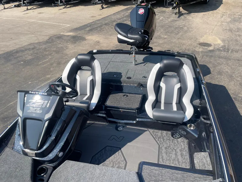 Slide: The Image of 2025 Nitro Z21 XL Pro boat interior with dual seats and steering console. - 8