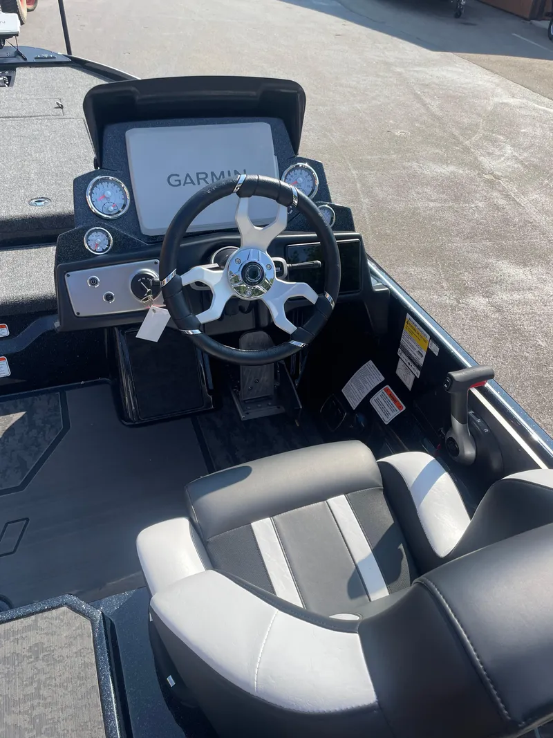 Slide: The Image of 2025 Nitro Z21 XL Pro boat cockpit with Garmin display and steering wheel. - 9