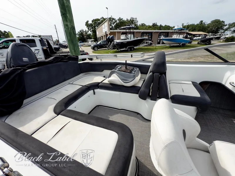 Slide: The Image of 2015 Caravelle 19 EBO boat interior with spacious seating and modern design. - 7