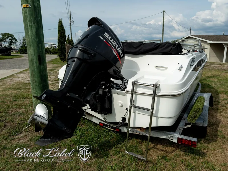 Slide: The Image of 2015 Caravelle 19 EBO boat with Suzuki outboard motor on trailer. - 8