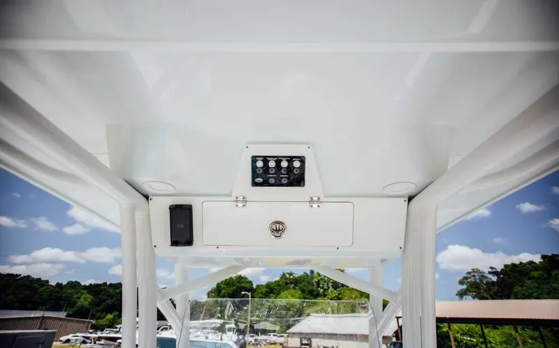 Slide: The Image of 2021 Sea Fox 248 Commander boat console with control panel under clear sky. - 15