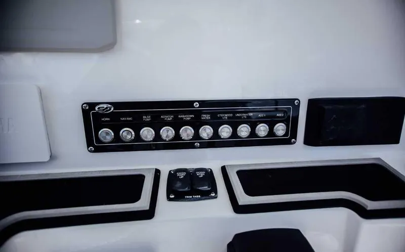 Slide: The Image of Control panel of a 2021 Sea Fox 248 Commander boat with labeled switches. - 18
