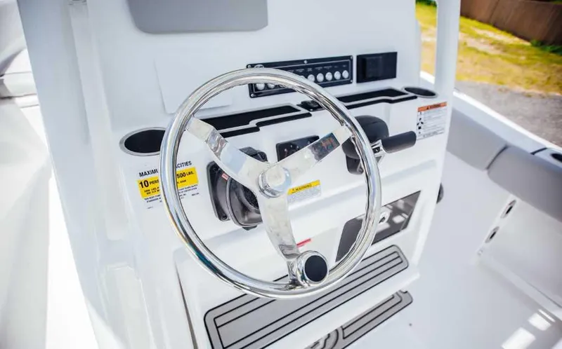 Slide: The Image of Steering console of 2021 Sea Fox 248 Commander boat with chrome wheel and controls. - 19