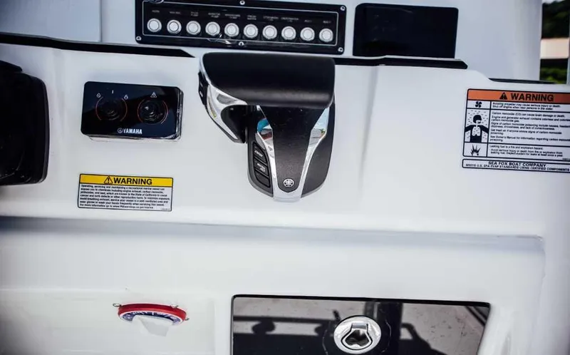 Slide: The Image of Control panel of 2021 Sea Fox 248 Commander boat with Yamaha throttle and warning labels. - 20
