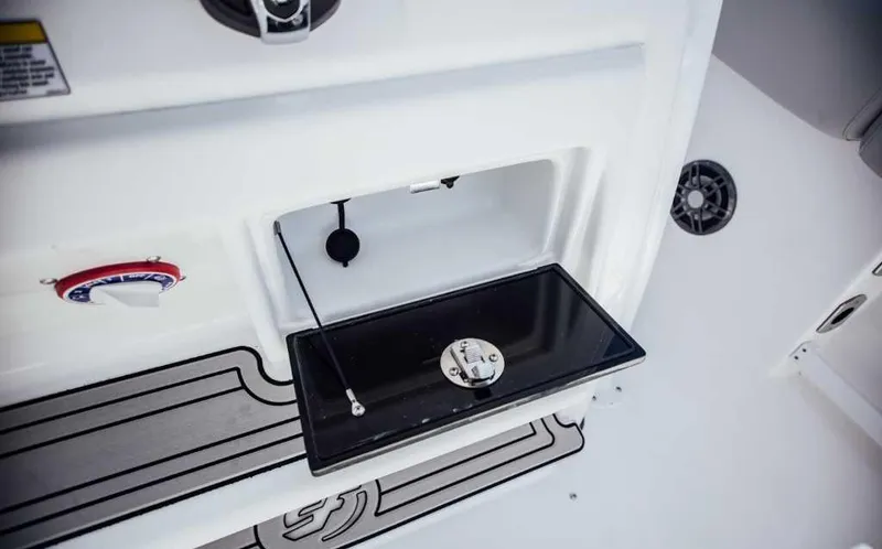 Slide: The Image of 2021 Sea Fox 248 Commander boat interior detail with storage compartment and control panel. - 23