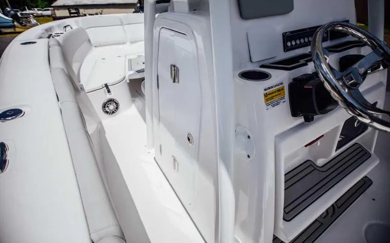 Slide: The Image of 2021 Sea Fox 248 Commander boat interior with steering wheel and seating area. - 5