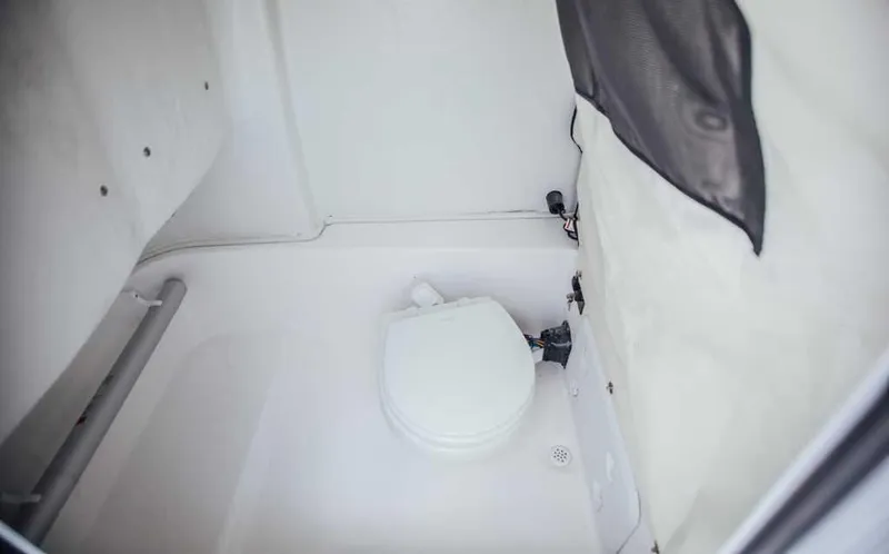 Slide: The Image of 2021 Sea Fox 248 Commander boat interior with compact marine toilet. - 7