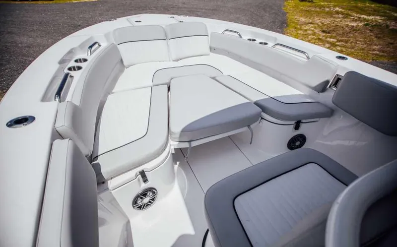 Slide: The Image of 2021 Sea Fox 248 Commander boat interior with cushioned seating and cup holders. - 8
