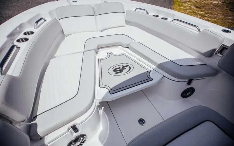 Slide: The Image of 2021 Sea Fox 248 Commander boat interior with white seating and cup holders. - 9