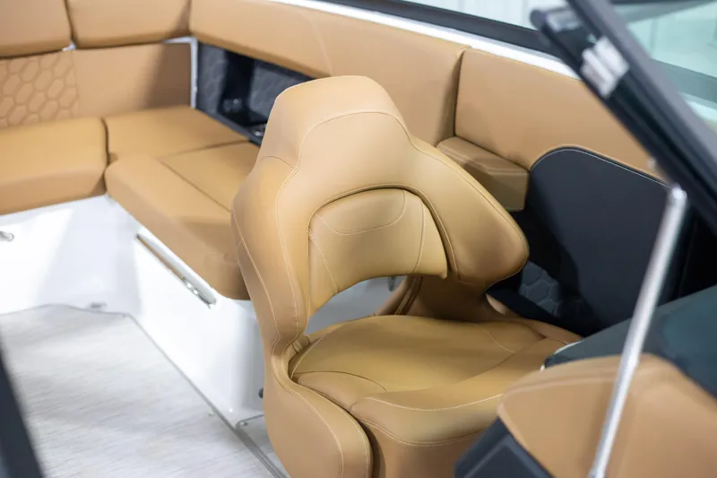 Slide: The Image of Luxurious interior of 2025 Four Winns H4 boat with tan leather seating. - 11