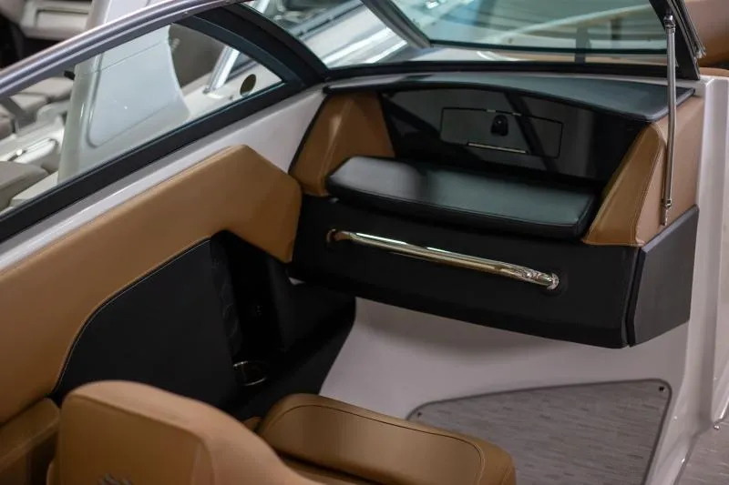 Slide: The Image of 2025 Four Winns H4 boat interior with tan and black seating. - 2