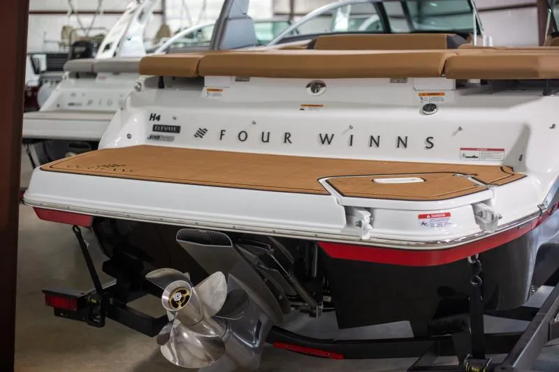 Slide: The Image of 2025 Four Winns H4 boat stern with propeller in showroom. - 3