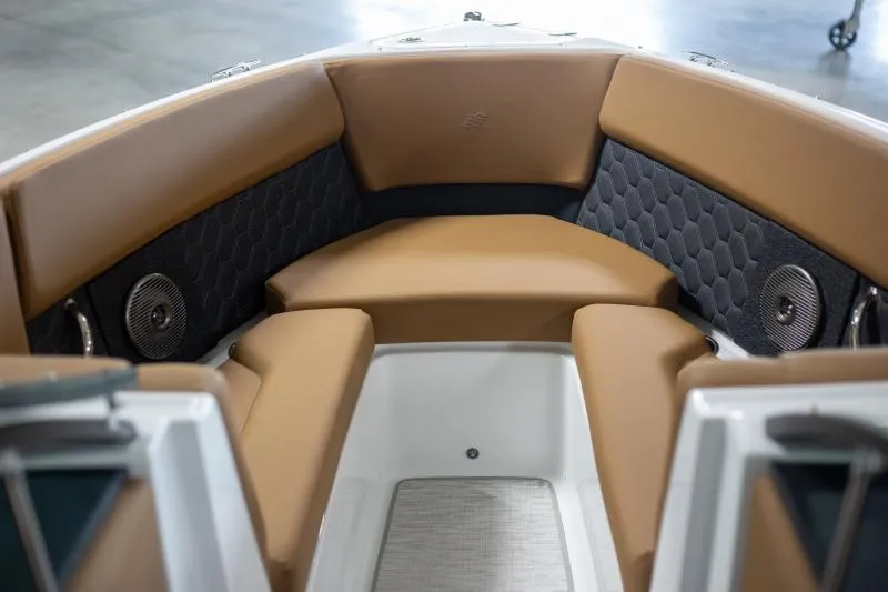 Slide: The Image of Luxurious interior of 2025 Four Winns H4 boat with tan seating and speakers. - 5