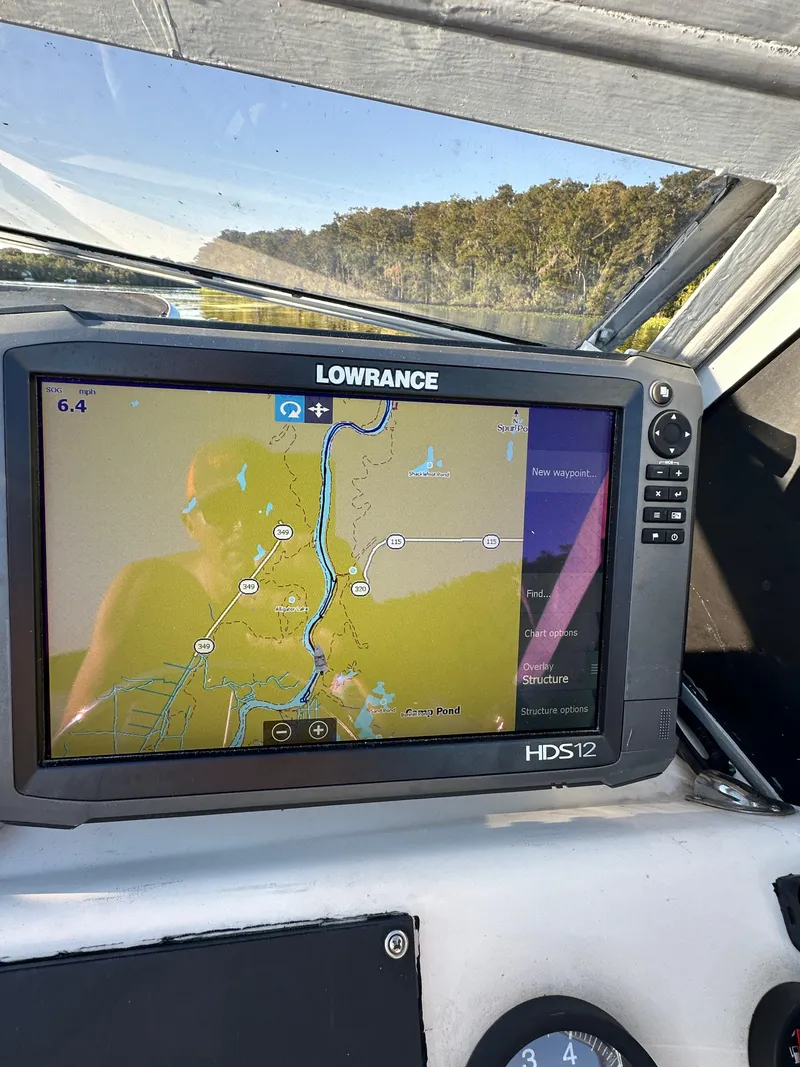 Slide: The Image of Lowrance HDS12 marine GPS displaying a river map on a 1987 Mako 228 boat. - 32