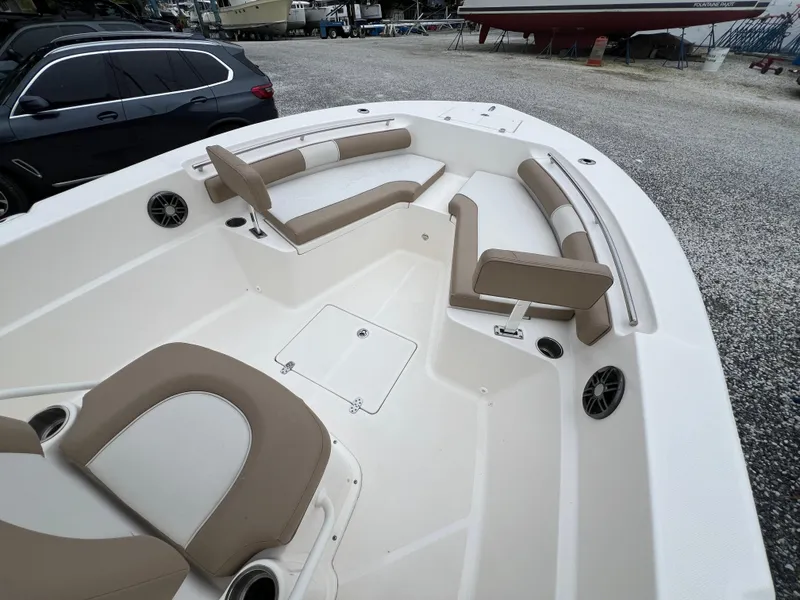 Slide: The Image of 2023 Sea Born LX24 Center Console boat with spacious seating and modern design. - 3