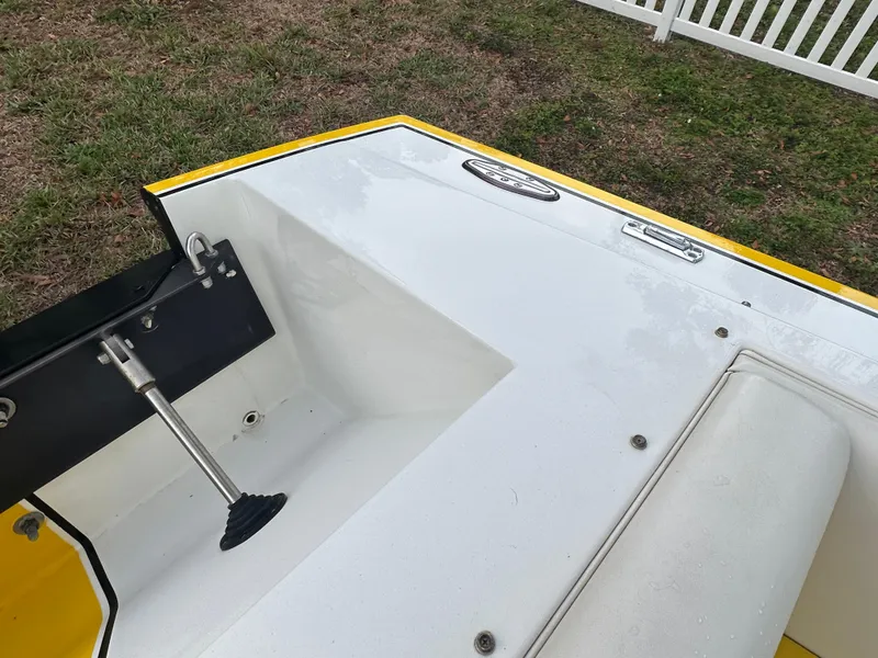 Slide: The Image of 1990 Superboat 21 interior detail with yellow trim and mechanical components. - 15