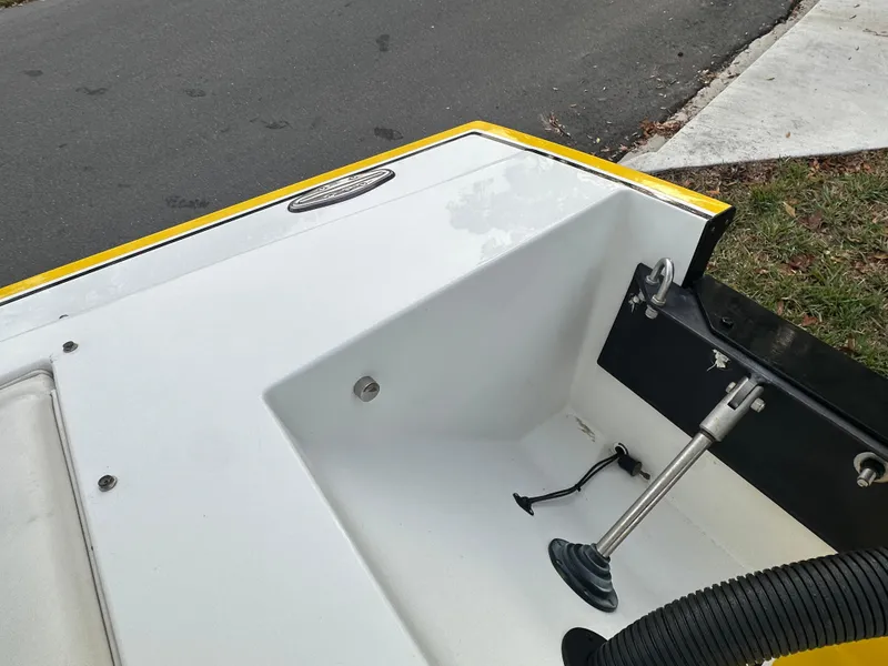 Slide: The Image of 1990 Superboat 21 interior detail, featuring sleek white and yellow design. - 16