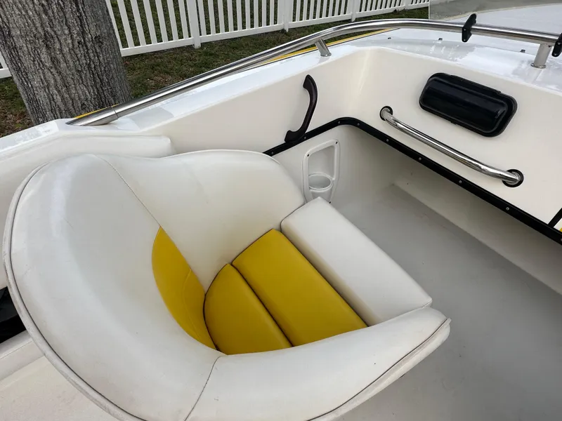 Slide: The Image of White and yellow seat in 1990 Superboat 21, featuring sleek interior design. - 20