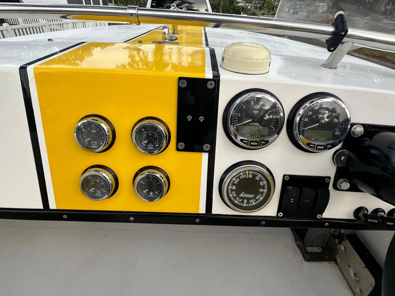 Slide: The Image of Dashboard of a 1990 Superboat 21 with gauges and controls. - 22
