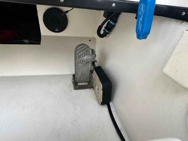 Slide: The Image of Interior of a 1990 Superboat 21 showing throttle pedal and wiring. - 25