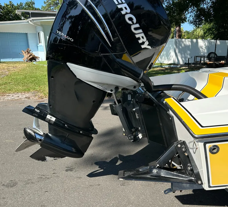 Slide: The Image of 1990 Superboat 21 with Mercury Verado outboard motor on a trailer. - 6