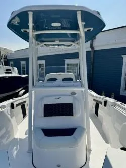 Slide: The Image of 2025 Tidewater 210CC Adventure boat with T-top, sleek design, and modern features. - 3