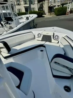 Slide: The Image of 2025 Tidewater 210CC Adventure boat interior with seating and speakers. - 4