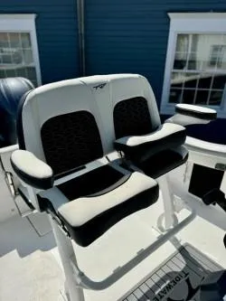 Slide: The Image of 2025 Tidewater 210CC Adventure boat seating with armrests, featuring modern design and comfort. - 5