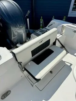 Slide: The Image of 2025 Tidewater 210CC Adventure boat with foldable seating and Yamaha engine. - 6