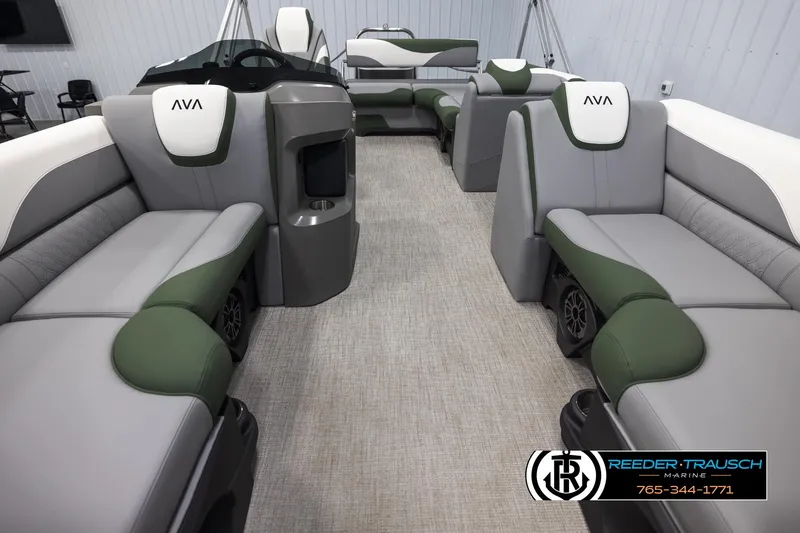 Slide: The Image of 2025 Avalon LSZ CRB pontoon boat interior with green and gray seating. - 13