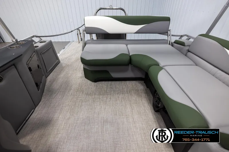Slide: The Image of 2025 Avalon LSZ CRB boat interior with gray and green seating, modern design. - 15