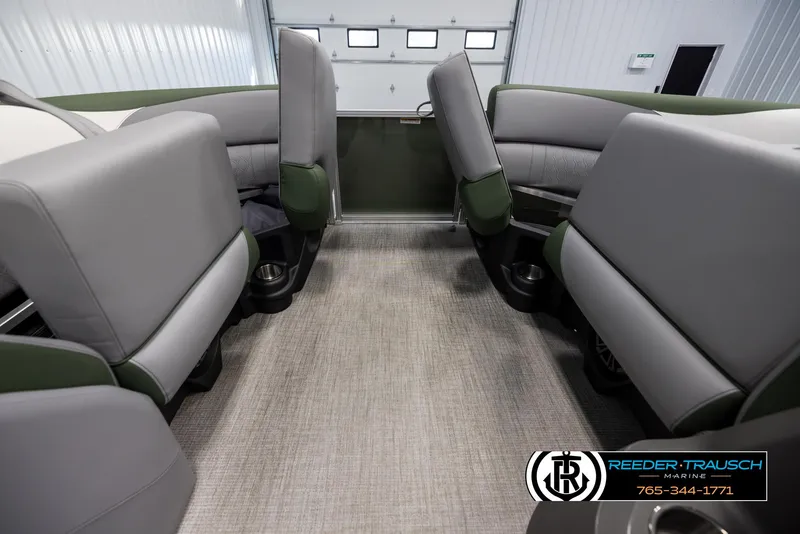 Slide: The Image of 2025 Avalon LSZ CRB interior with gray and green seating in a showroom. - 19