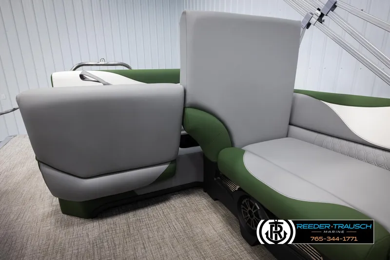 Slide: The Image of 2025 Avalon LSZ CRB boat interior with green and gray seating. - 26