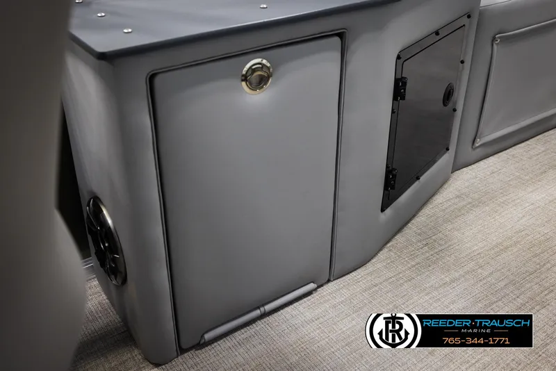 Slide: The Image of 2025 Avalon LSZ CRB boat interior storage compartments with Reeder-Trausch Marine branding. - 27