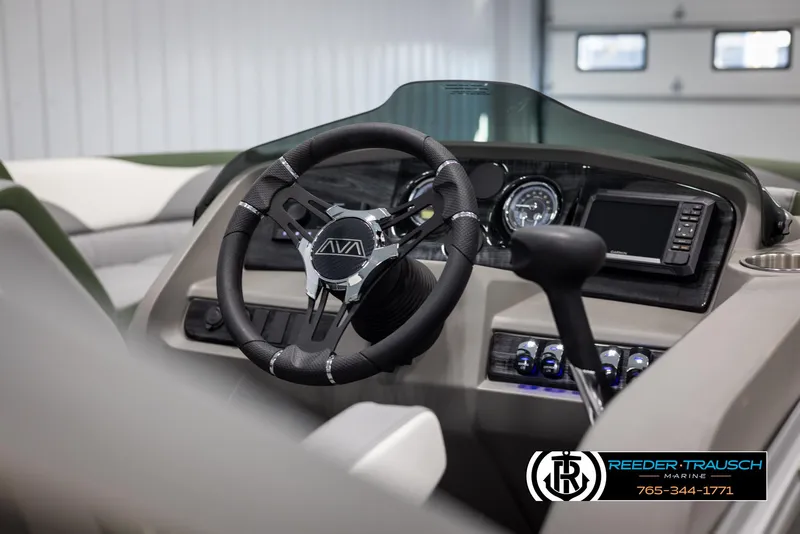 Slide: The Image of 2025 Avalon LSZ CRB boat dashboard with steering wheel and controls. - 29