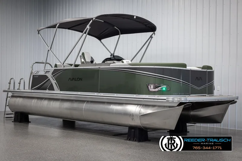 Slide: The Image of 2025 Avalon LSZ CRB pontoon boat with canopy in showroom. - 3
