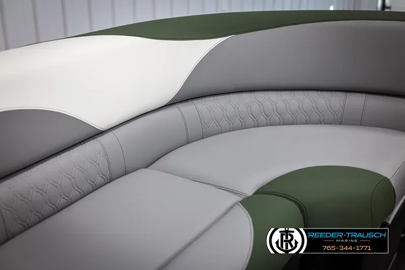 Slide: The Image of 2025 Avalon LSZ CRB boat seating with green, gray, and white upholstery. - 37