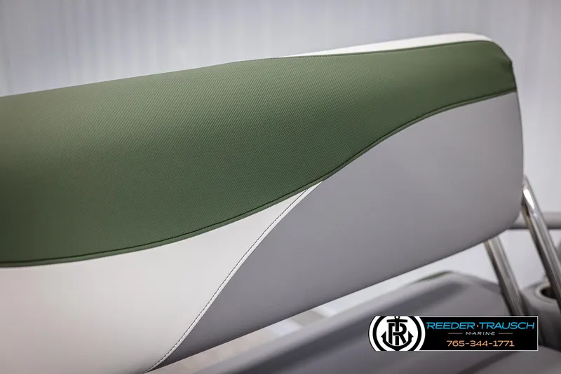 Slide: The Image of 2025 Avalon LSZ CRB boat seat with green and white upholstery. - 38