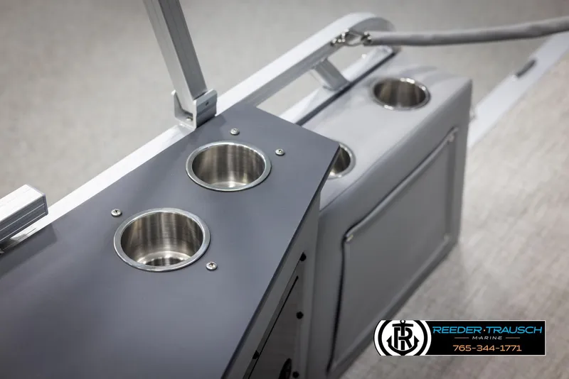 Slide: The Image of 2025 Avalon LSZ CRB boat console with cup holders and storage compartment. - 40