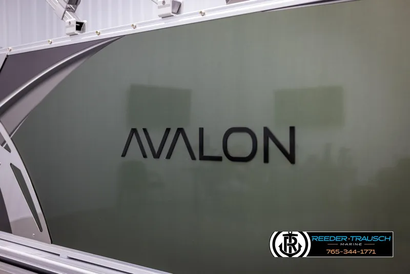 Slide: The Image of 2025 Avalon LSZ CRB boat side view with logo and branding. - 47