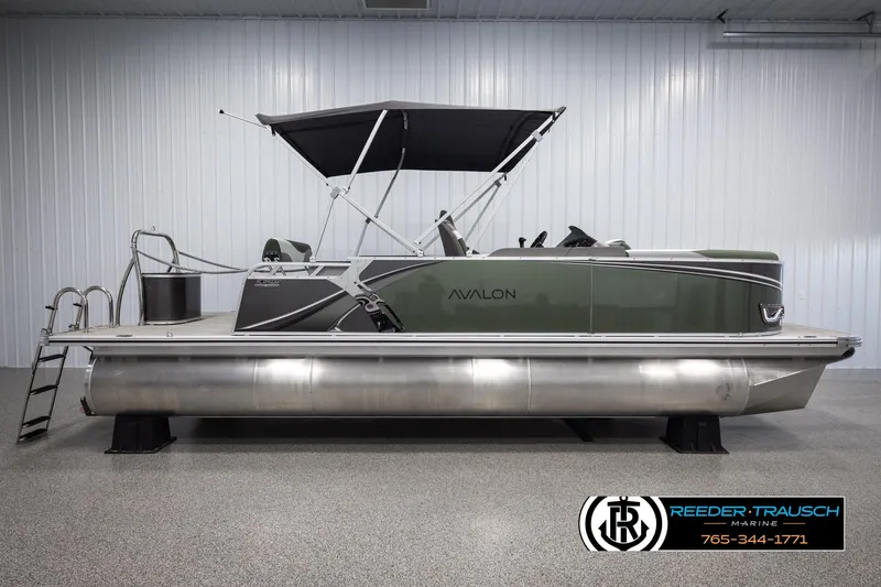Slide: The Image of 2025 Avalon LSZ CRB pontoon boat with canopy in showroom. - 5