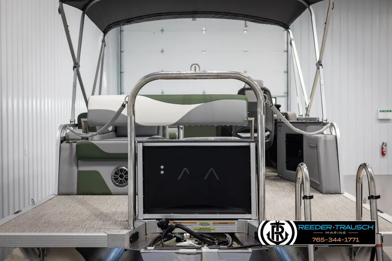Slide: The Image of 2025 Avalon LSZ CRB pontoon boat interior with seating and canopy in a showroom. - 7