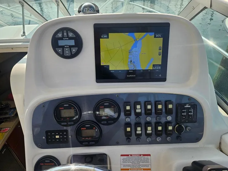 Slide: The Image of 2005 Robalo R265 Walkaround dashboard with navigation system and control panel. - 13