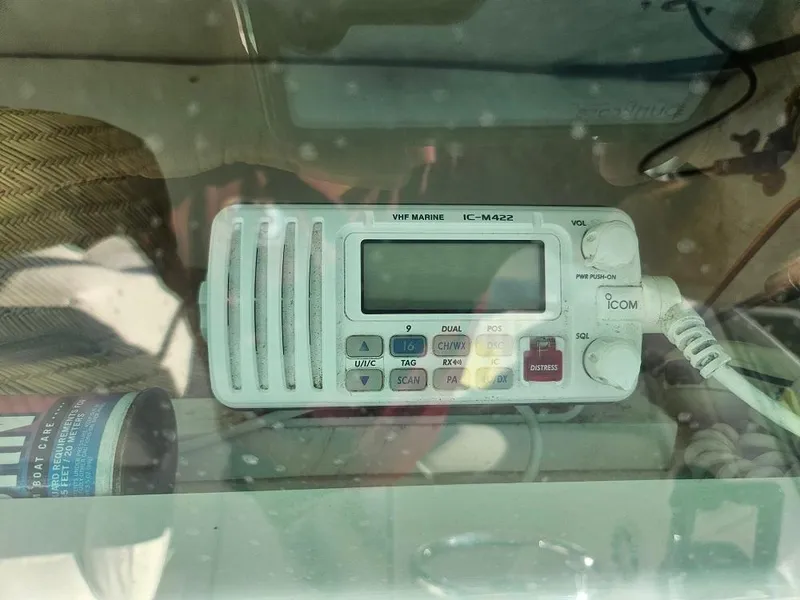Slide: The Image of VHF marine radio on 2005 Robalo R265 Walkaround boat dashboard. - 8
